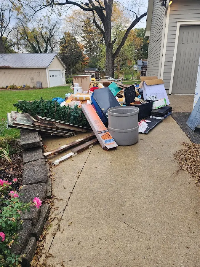 Dumpster being loaded with debris for Roofing Dumpster Rental in Oregon